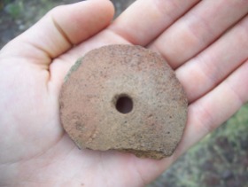 An Ancestral Puebloan spindle whorl used in making textiles.